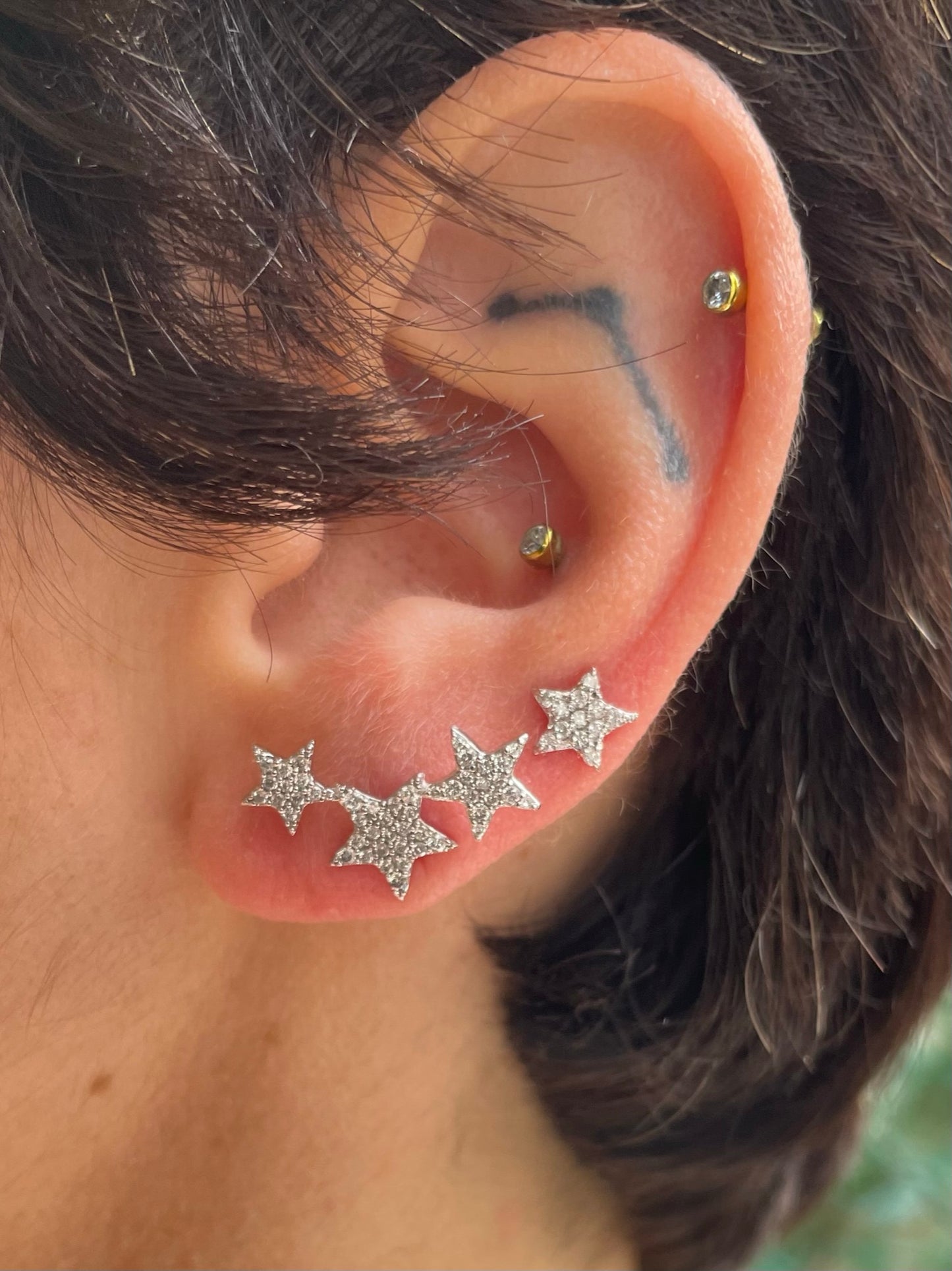 .stardust. -mono orecchino tre stelle in oro 18kt