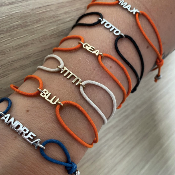 Nomi e cordino - bracciale in oro 18kt