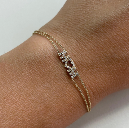 Bracciale con scritta o simbolo in oro 18kt e diamanti