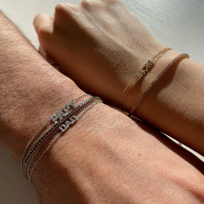 Bracciale con scritta o simbolo in oro 18kt e diamanti